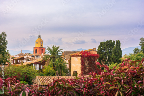 Scenic view of Saint Tropez in autumn warm colors against dramatic sky
