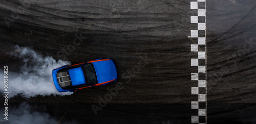 Aerial top view car drifting diffusion race drift car with lots of smoke from burning tires on speed track, Professional driver drifting car with lots of white smoke.