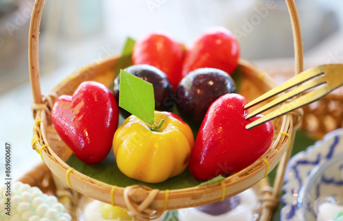 Mini Fruits and Vegetables Shaped Thai Style Marzipan Called Kanom Look Choup, a Famous Thai Traditional Dessert photo