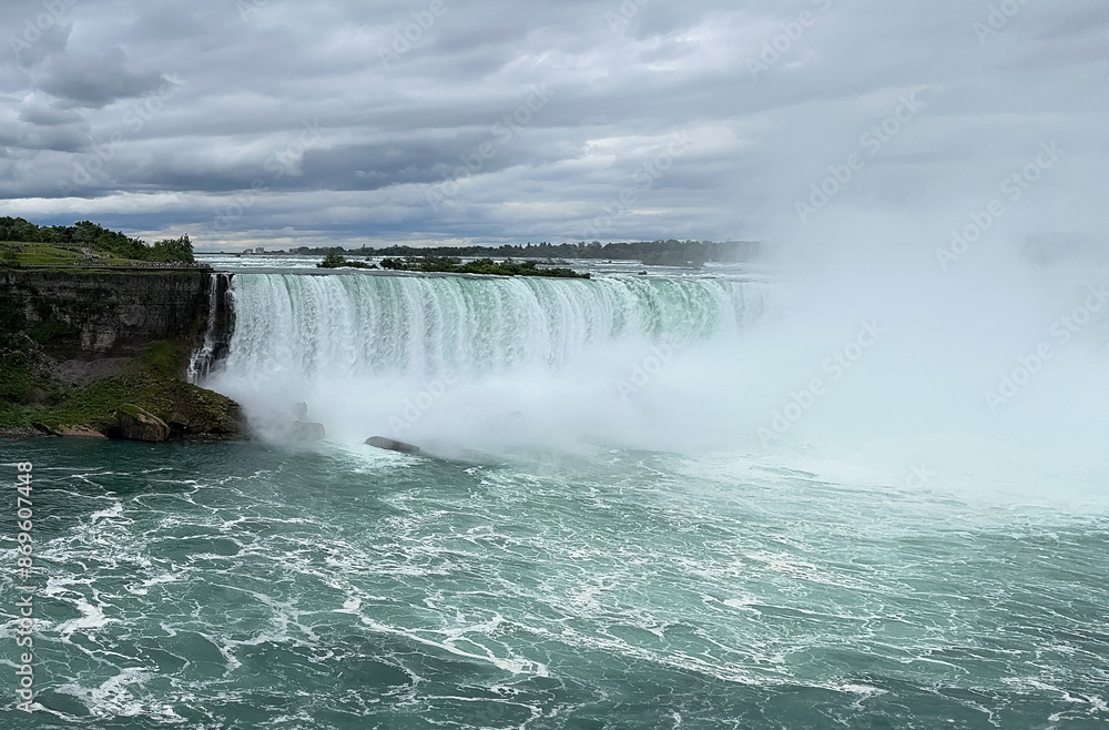 Niagara Falls, Ontario, Canada. The Niagara Falls is a series of waterfalls on the Niagara River. Niagara Falls, Ontario, Canada. The Niagara Falls is a series of waterfalls on the Niagara River.