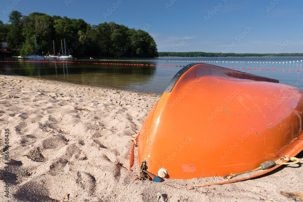 SWIMMING BEACH BY THE LAKE - Rowing water rescue boat on the sand
SWIMMING BEACH BY THE LAKE - Rowing water rescue boat on the sand