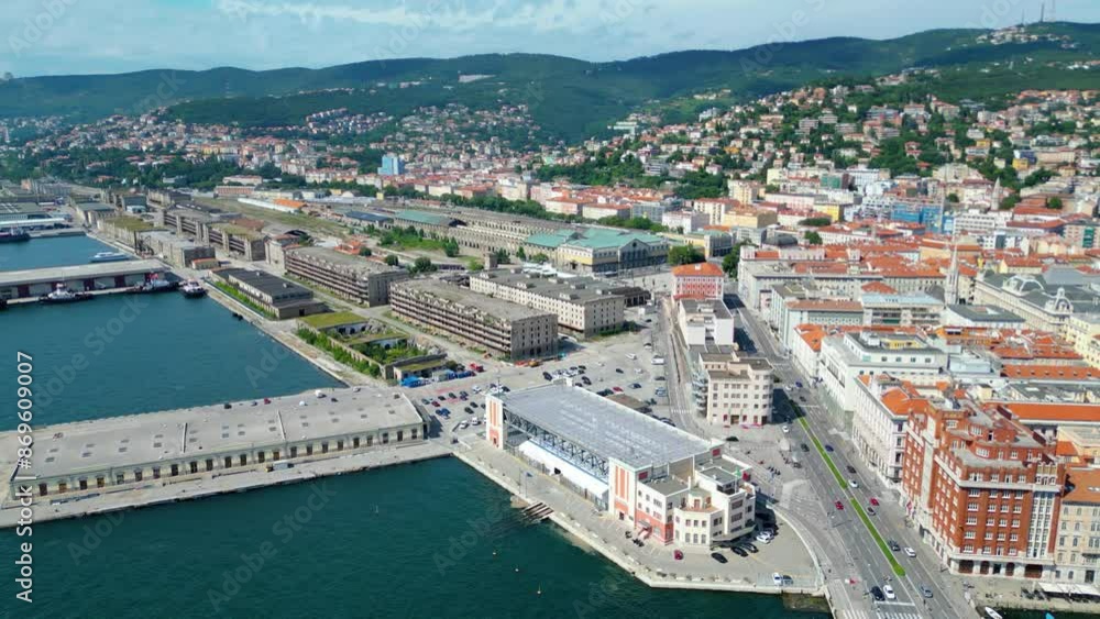 An impressive aerial shot of Trieste, Italy, featuring a majestic cruise ship docked at the port. This vibrant city, known for its rich history, stunning architecture, and bustling waterfront An impressive aerial shot of Trieste, Italy, featuring a majestic cruise ship docked at the port. This vibrant city, known for its rich history, stunning architecture, and bustling waterfront