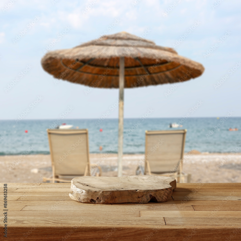 Beach chairs and big sun umbrella on the beach with seascape background. Beach chairs and big sun umbrella on the beach with seascape background.