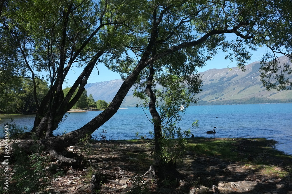 Photo of lakeside view of Lake Wakatipu or Whakatipu wai-maori and The Remarkables in Glenorchy, Otago region, South Island of New Zealand. Photo of lakeside view of Lake Wakatipu or Whakatipu wai-maori and The Remarkables in Glenorchy, Otago region, South Island of New Zealand.