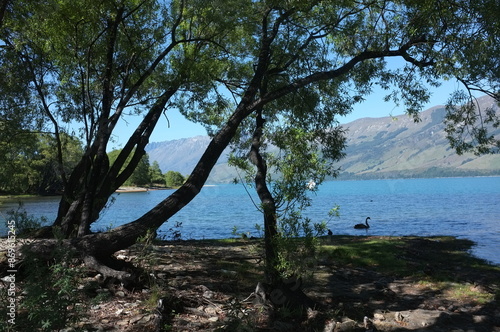 Photo of lakeside view of Lake Wakatipu or Whakatipu wai-maori and The Remarkables in Glenorchy, Otago region, South Island of New Zealand.