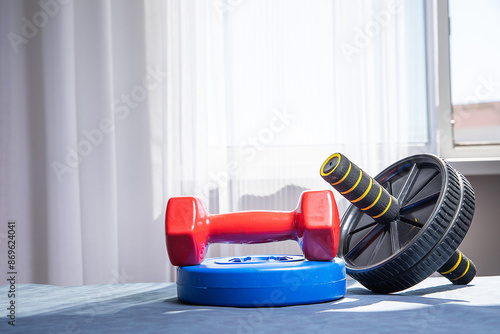 dumbbells and exercise wheel
exercise at home healthy lifestyle