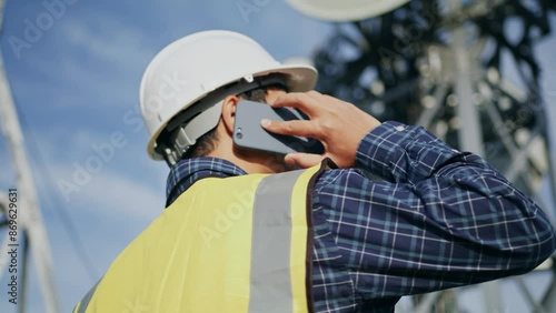 An engineer working on the mountain with telecommunication station, communication network and telecom connection 5G, 6G
