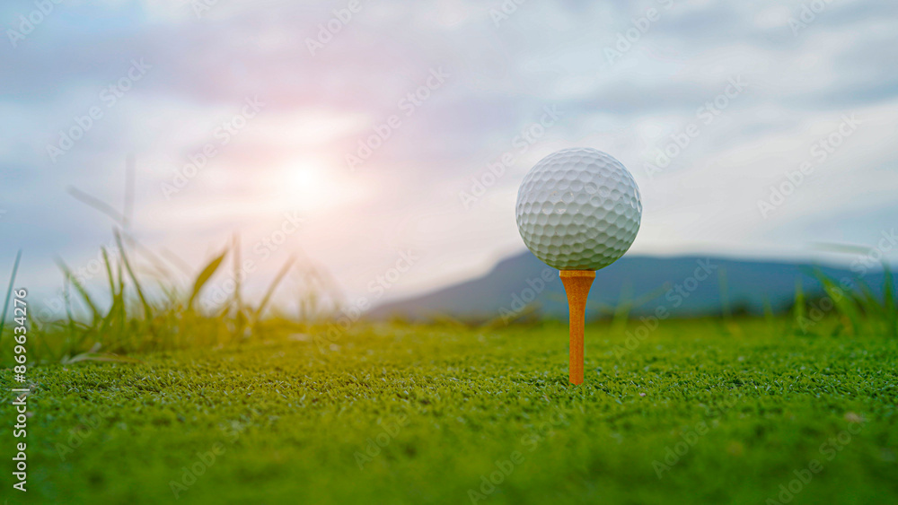 golf ball on tee in beautiful golf course with sunset. Golf ball close up in golf coures. golf ball on tee in beautiful golf course with sunset. Golf ball close up in golf coures.