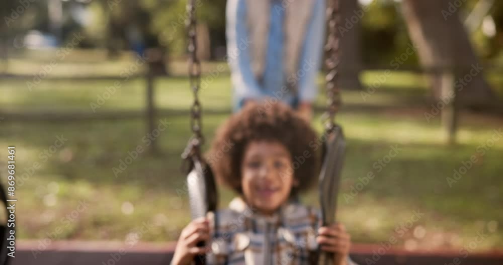 Mother, child and playing with swing at park for fun ride, bonding or outdoor holiday weekend in nature. Happy little boy, child or kid with parent in joy, happiness or cheerful playground in woods Mother, child and playing with swing at park for fun ride, bonding or outdoor holiday weekend in nature. Happy little boy, child or kid with parent in joy, happiness or cheerful playground in woods