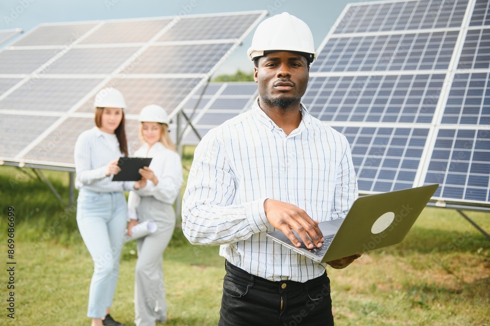 African american technician check the maintenance of the solar panels. Black man engineer at solar station African american technician check the maintenance of the solar panels. Black man engineer at solar station