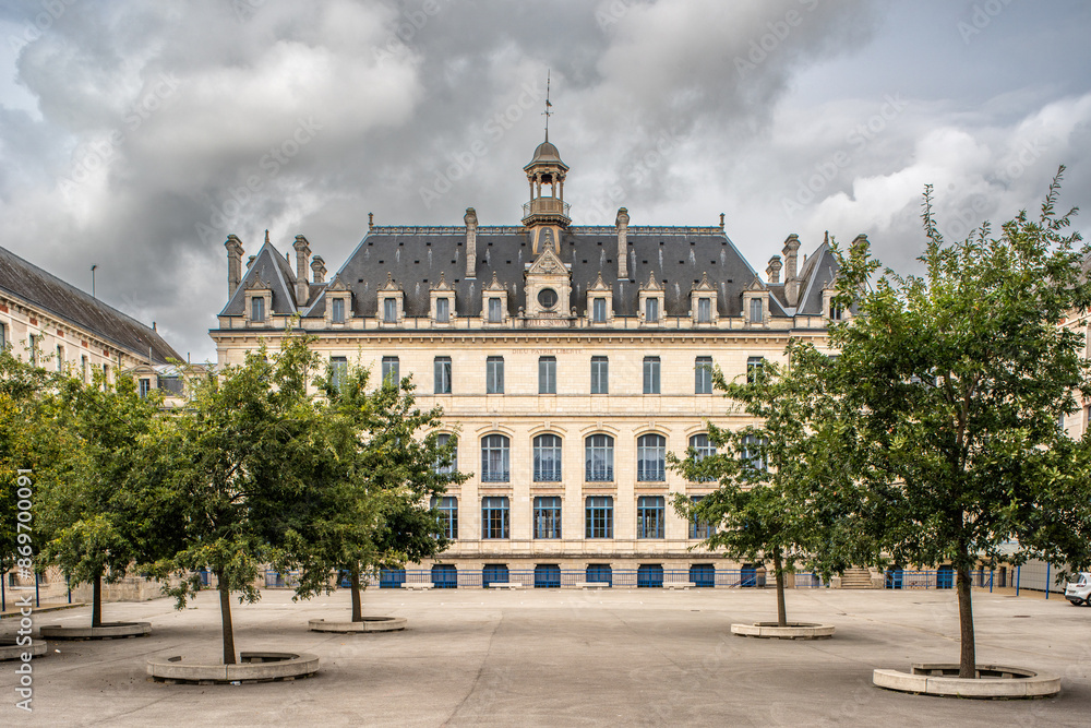 Fototapeta premium Historic Building in Vannes, Brittany, France with Trees in Foreground