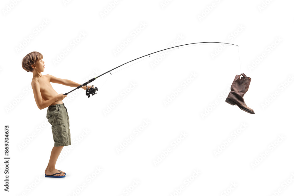 Obraz premium Full length profile shot of a boy catching an old boot with a fishing rod