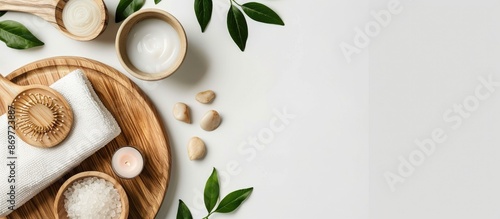 Spa-themed wooden tray arrangement on white backdrop with copy space image.