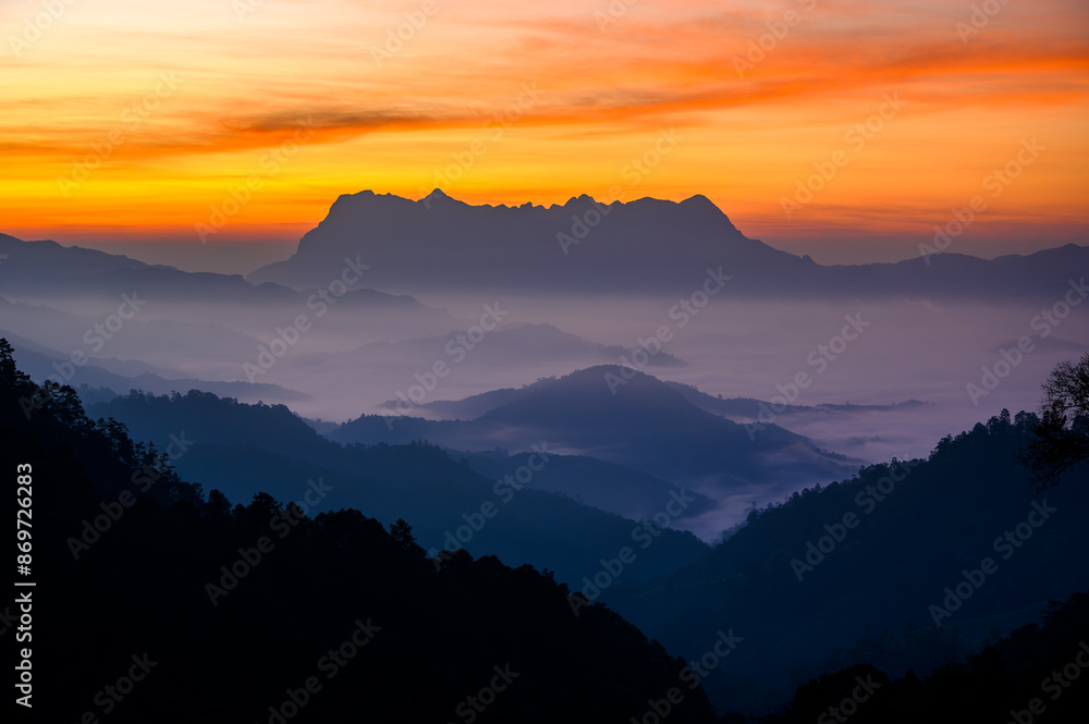 Doi Luang Chiang Dao misty mountain landscape at morning in cloudy sunrise sky Doi Luang Chiang Dao misty mountain landscape at morning in cloudy sunrise sky