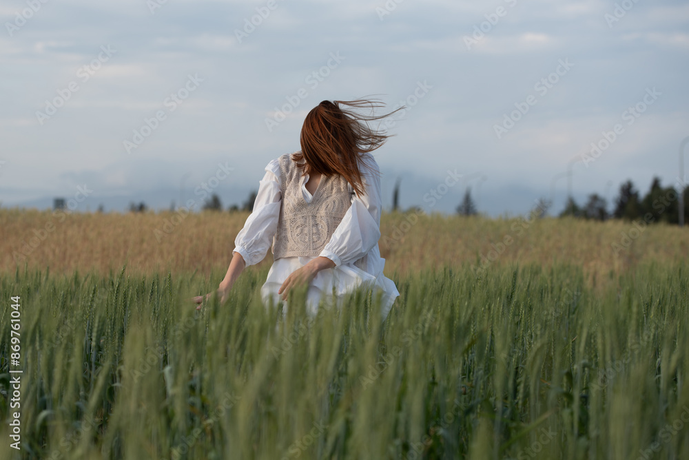 Young woman dancing outdoors. Modern dance performance in the meadow field. Carefree and freedom in nature Young woman dancing outdoors. Modern dance performance in the meadow field. Carefree and freedom in nature