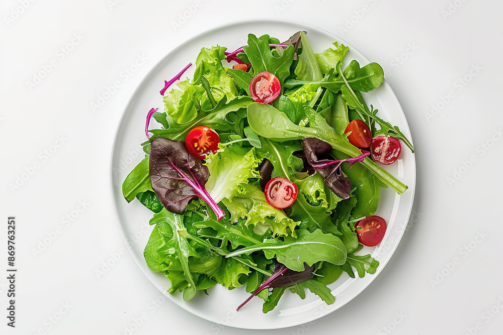 A plate of salad with lettuce, tomatoes, and spinach A plate of salad with lettuce, tomatoes, and spinach