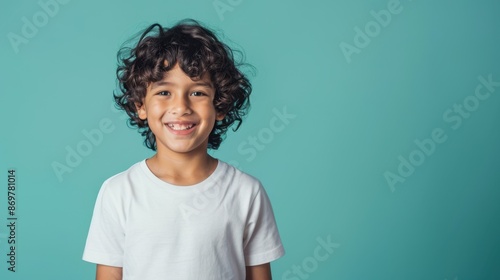The smiling young boy.