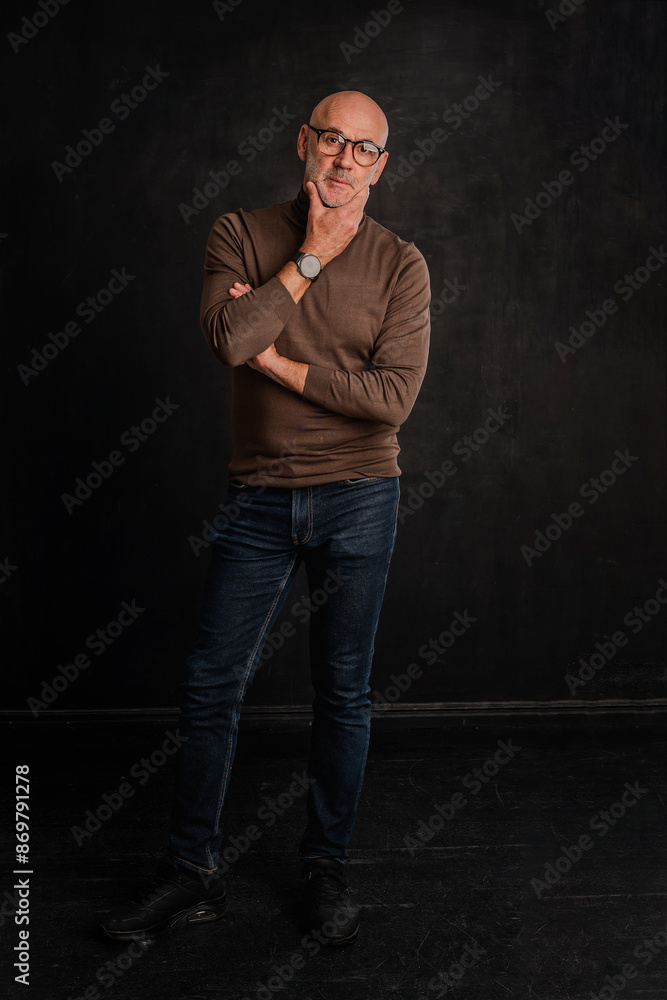 Full length of a mid aged man standing against isolated background Full length of a mid aged man standing against isolated background