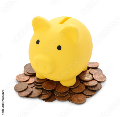 Yellow piggy bank and coins isolated on white