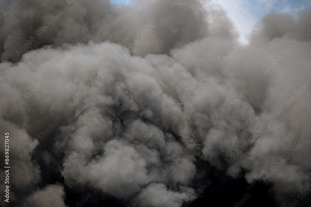 Toxic black smoke from fire against sky, burning plastic. Toxic black smoke from fire against sky, burning plastic.