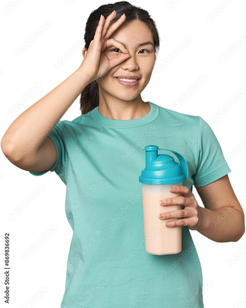Chinese athlete with protein shake excited keeping ok gesture on eye. Chinese athlete with protein shake excited keeping ok gesture on eye.