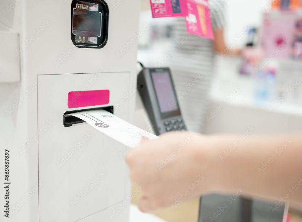 Girl Receives Receipt At Self-Service Checkout Terminal, Close-Up Of Hands Girl Receives Receipt At Self-Service Checkout Terminal, Close-Up Of Hands