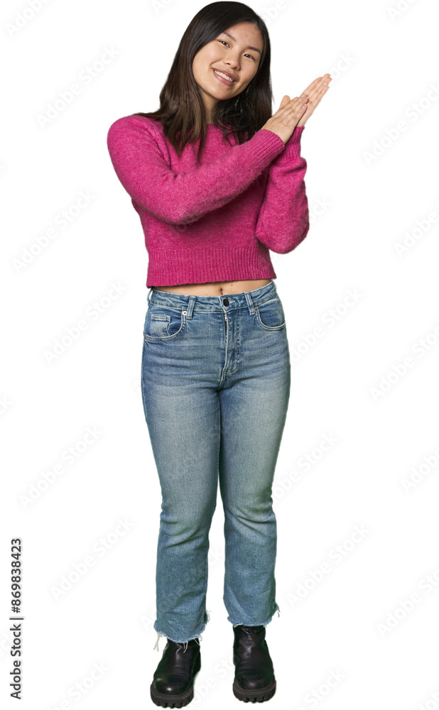Full-body young Chinese woman feeling energetic and comfortable, rubbing hands confident. Full-body young Chinese woman feeling energetic and comfortable, rubbing hands confident.