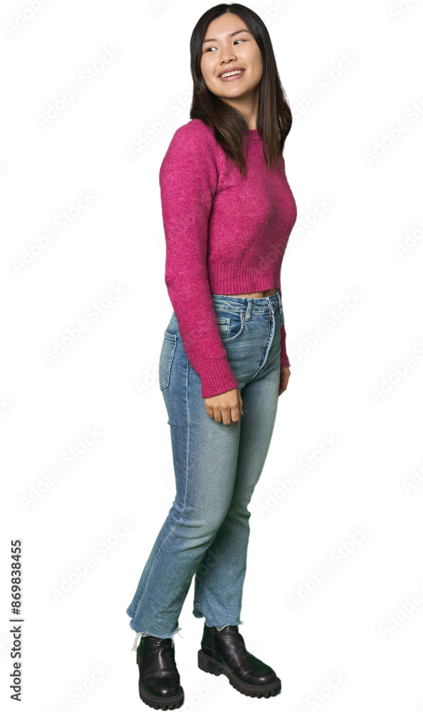 Full-body young Chinese woman looks aside smiling, cheerful and pleasant. Full-body young Chinese woman looks aside smiling, cheerful and pleasant.