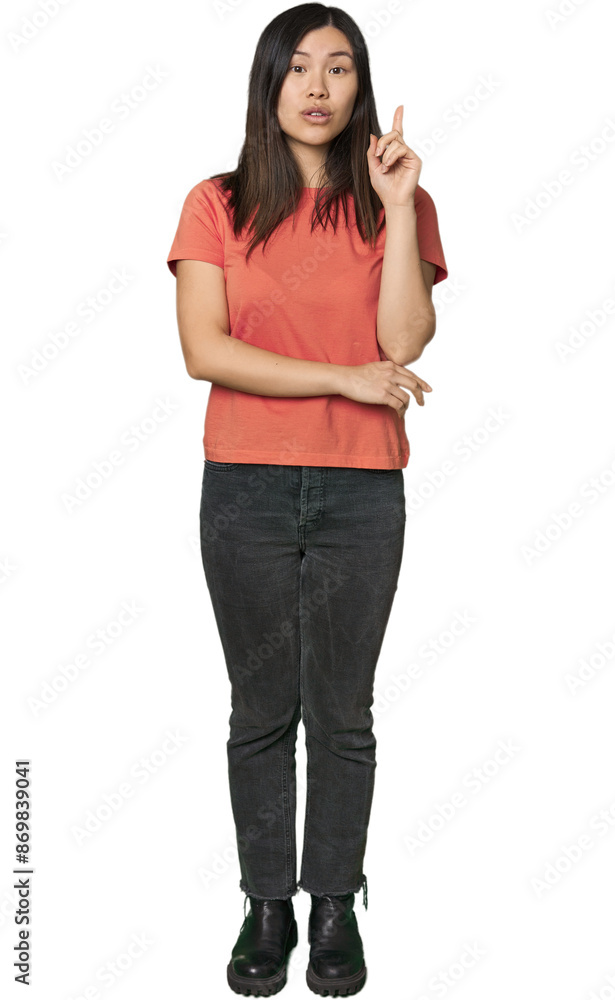 Full-body young Chinese woman having some great idea, concept of creativity. Full-body young Chinese woman having some great idea, concept of creativity.