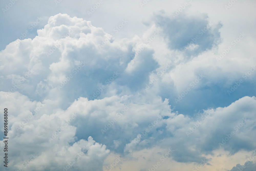 Grey blue sky with white fluffy clouds, natural photography background Grey blue sky with white fluffy clouds, natural photography background