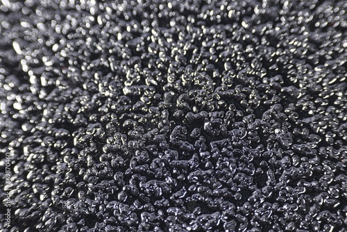 Texture of coarse sandpaper as background, closeup