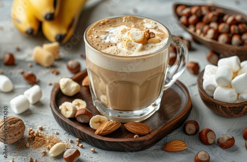 Almond and Banana Latte With Marshmallows and Nuts on a Wooden Tray