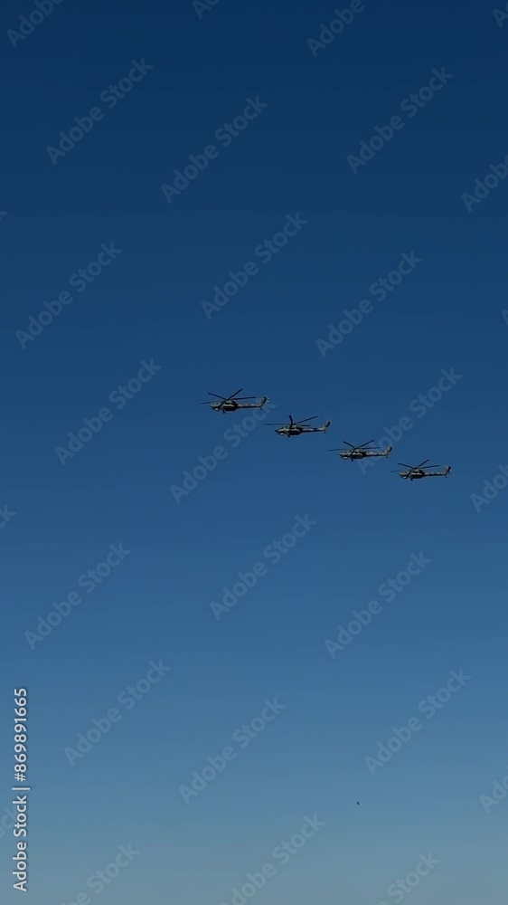 Military helicopters fly over the city. Near residential buildings. Military helicopters fly over the city. Near residential buildings.