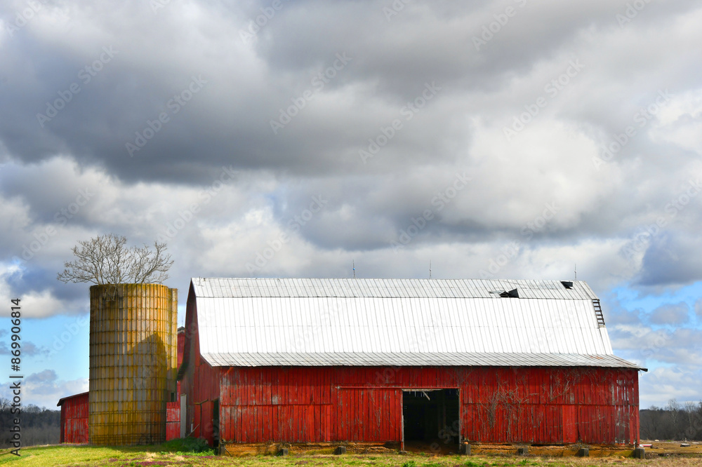 Barn and Silo With Tree Growing Out of it Barn and Silo With Tree Growing Out of it