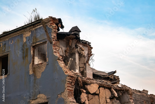 Fotografie A demolished old and abandoned building with a forfeited ceiling and destroyed walls