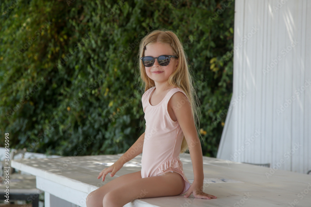 Portrait of adorable little girl enjoying summer vacation in the beach bar Portrait of adorable little girl enjoying summer vacation in the beach bar