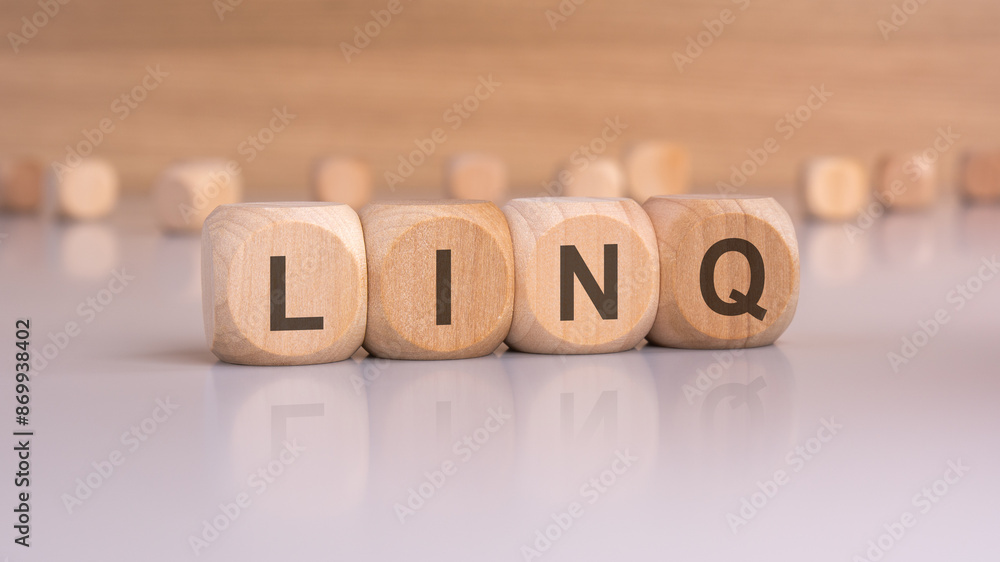 wooden blocks with text linq, brown background wooden blocks with text linq, brown background