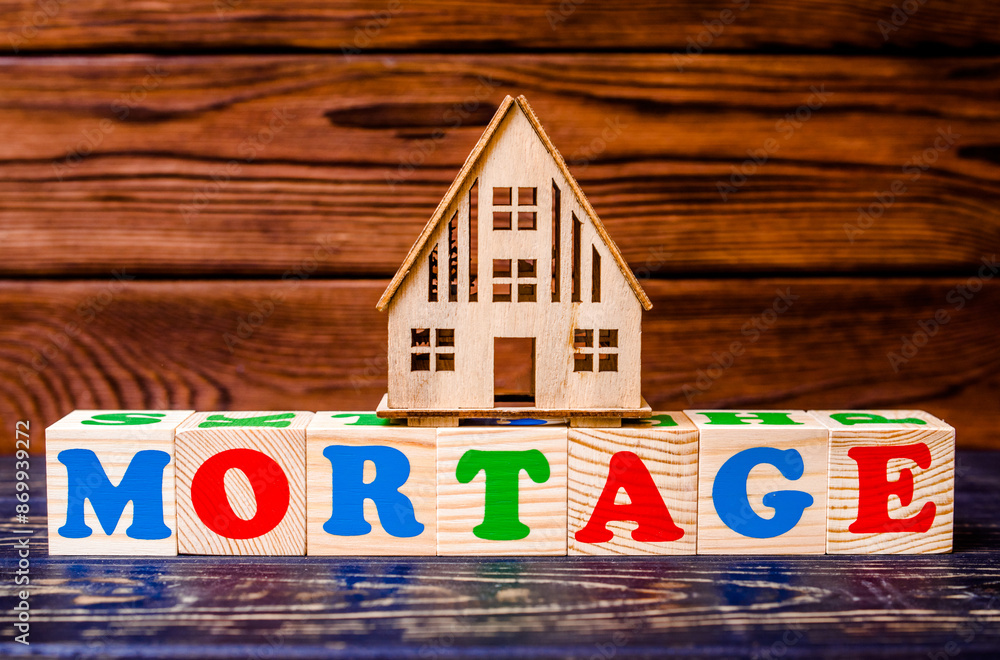 Fototapeta premium Wooden home and text on the cubes MORTAGE 