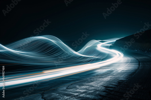 A striking long-exposure photograph capturing the dynamic movement of light trails on a winding road at night, creating an abstract and futuristic visual effect