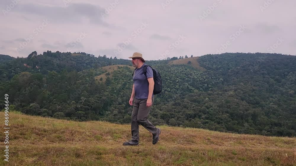 Man walking through the nature in a rainforest in Brazil Man walking through the nature in a rainforest in Brazil