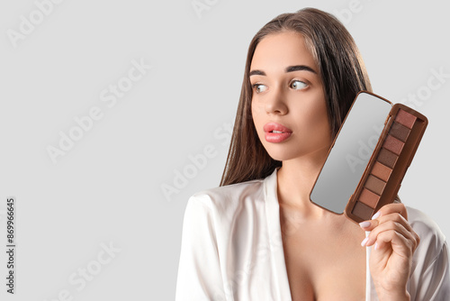 Young woman with makeup cos...