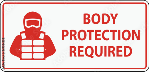 A clear safety sign indicating the mandatory use of body protection gear in a designated area.