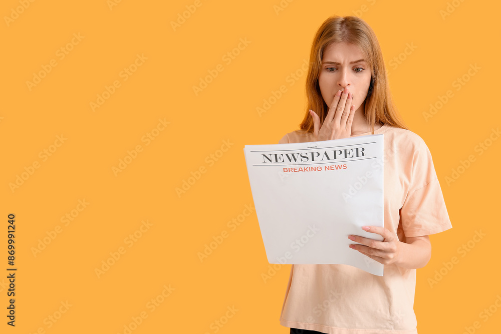 Emotional young woman reading newspaper against color background Emotional young woman reading newspaper against color background