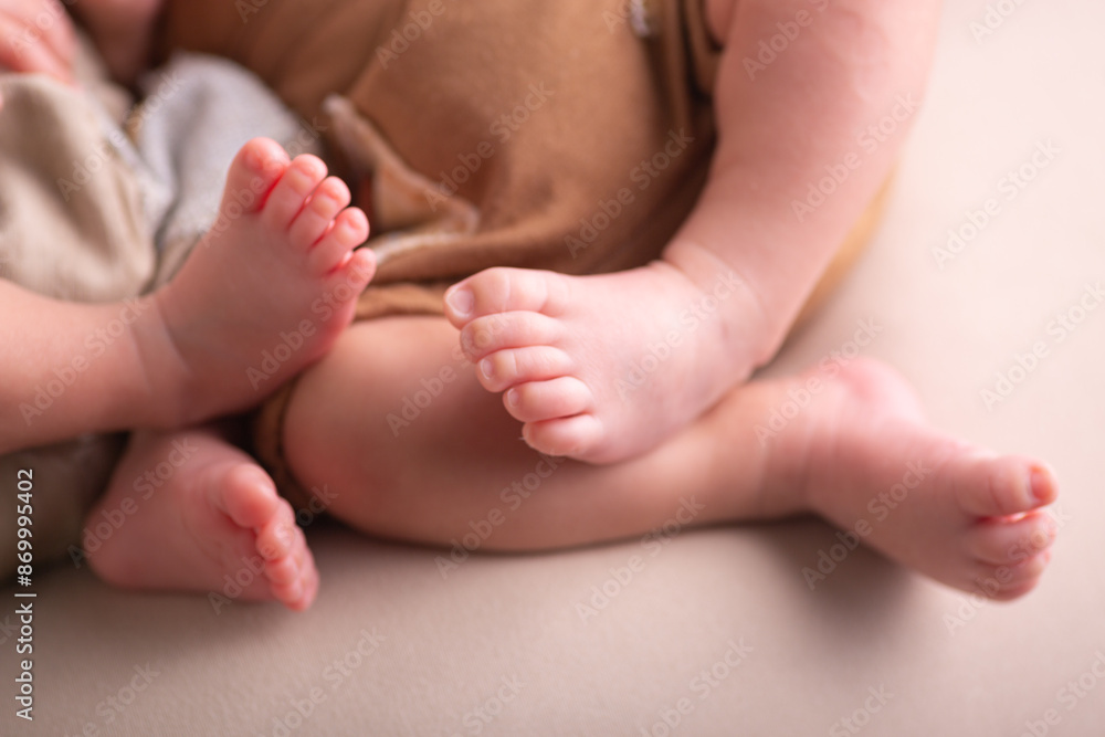 Little newborn baby human feet with toes and toenails close up Little newborn baby human feet with toes and toenails close up