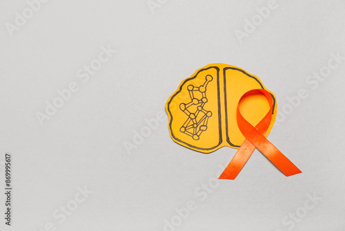 Paper brain with orange rib...