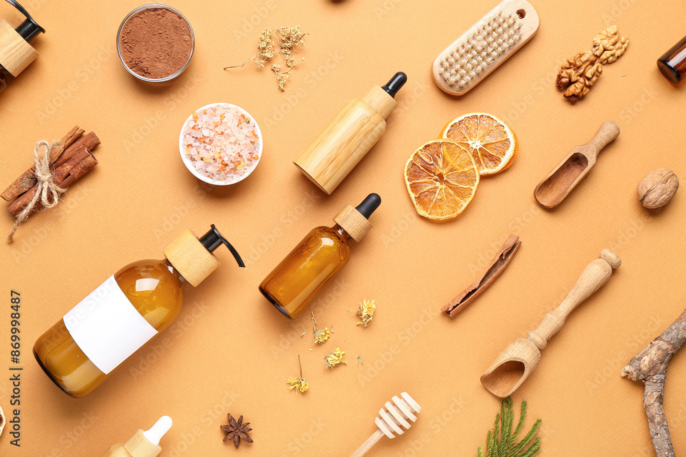 Bottles of essential oil and different ingredients on brown background Bottles of essential oil and different ingredients on brown background
