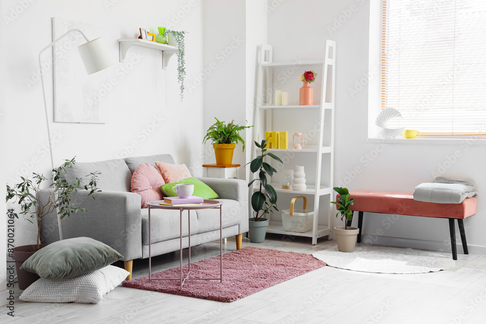 Obraz premium Cozy sofa and coffee table in interior of living room