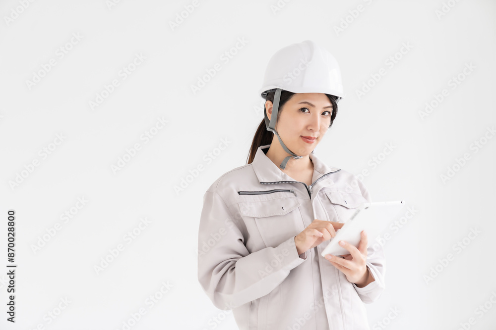 作業着姿の女性 タブレット 作業着姿の女性 タブレット