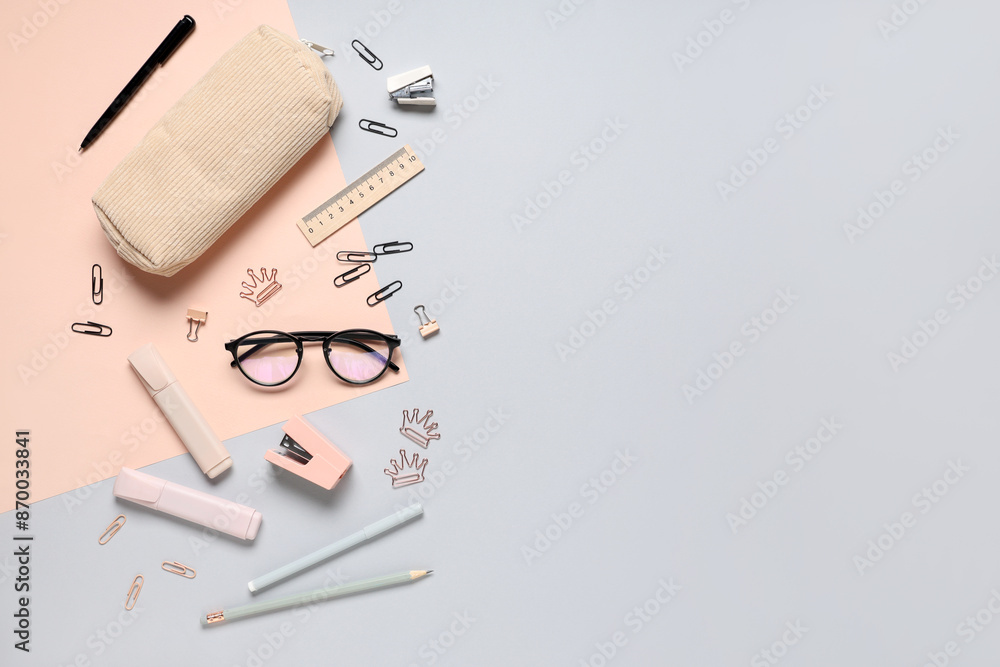Eyeglasses and different stationery on color background Eyeglasses and different stationery on color background