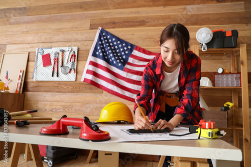 Female Asian worker with ho...
